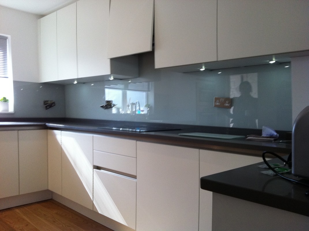 Grey glass kitchen splashback with LED lighting in Lee