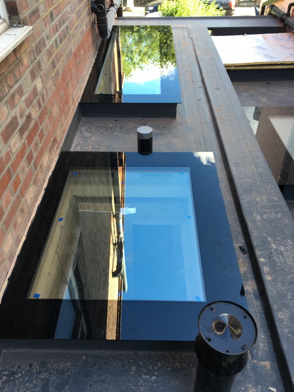 Multiple flat roof skylights on extension in Lee